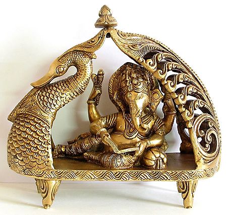 Ganesha Reading Book Reclining on Peacock Bed