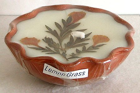 Lemon Grass Perfumed Candle with Natural Flowers Placed inside Candle Stand