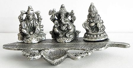 Ghee or Oil Lamp with Lakshmi, Ganesha and Kubera on Banana Leaf