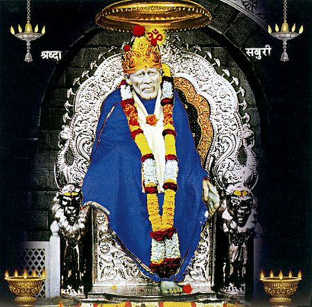 Shirdi Sai Baba in Blue Robe Sitting on Throne