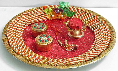 Decorated Steel Puja Thali with Two Sindoor Containers, Oil Lamp, Red thread and a Small Garland