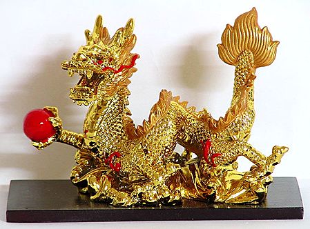 Golden Chinese Dragon Holding Red Ball