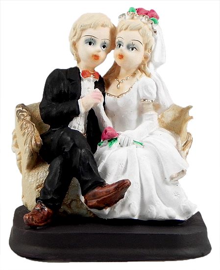 Wedded Couple Siting on a Coutch