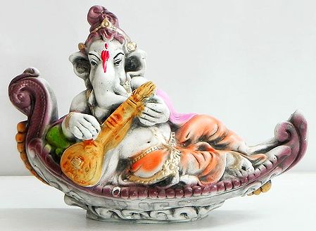 Reclining Ganesha Playing Veena on a Boat
