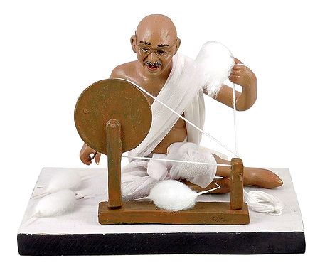 Mahatma Gandhi with his Charkha (Spinning Wheel)