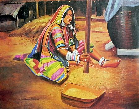 A Tribal Woman Grinding Grains