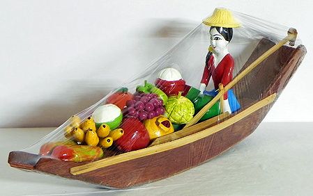 Girl Selling Vegetable and Fruits on Boat