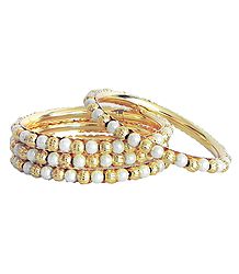 Set of Four Golden and White Bead Bangles