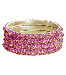 Four Pink with Golden Stone Studded Bangles