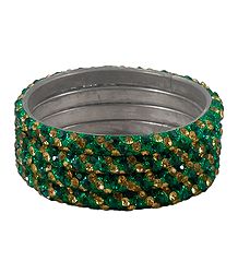 4 Green and Golden Stone Studded Metal Bangles