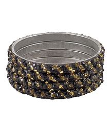 4 Black and Golden Stone Studded Metal Bangles