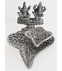 Oil Lamp on a Conch with Ganesha and Lakshmi