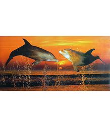 Two Dolphins Dancing in the Ocean During Sunset