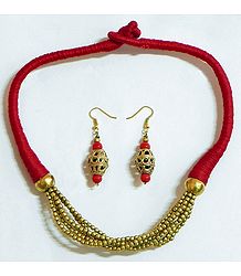 Golden Bead Necklace and Dhokra Earrings with Red Threaded Cord