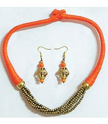 Golden Bead Necklace and Dhokra Earrings with Saffron Threaded Cord