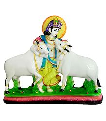 Cowherd Krishna Embracing His Cows  