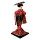 Geisha Doll in Red Kimono Dress Holding Fan