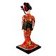 japanese Geisha Doll in Red Kimono Dress Playing Guitar